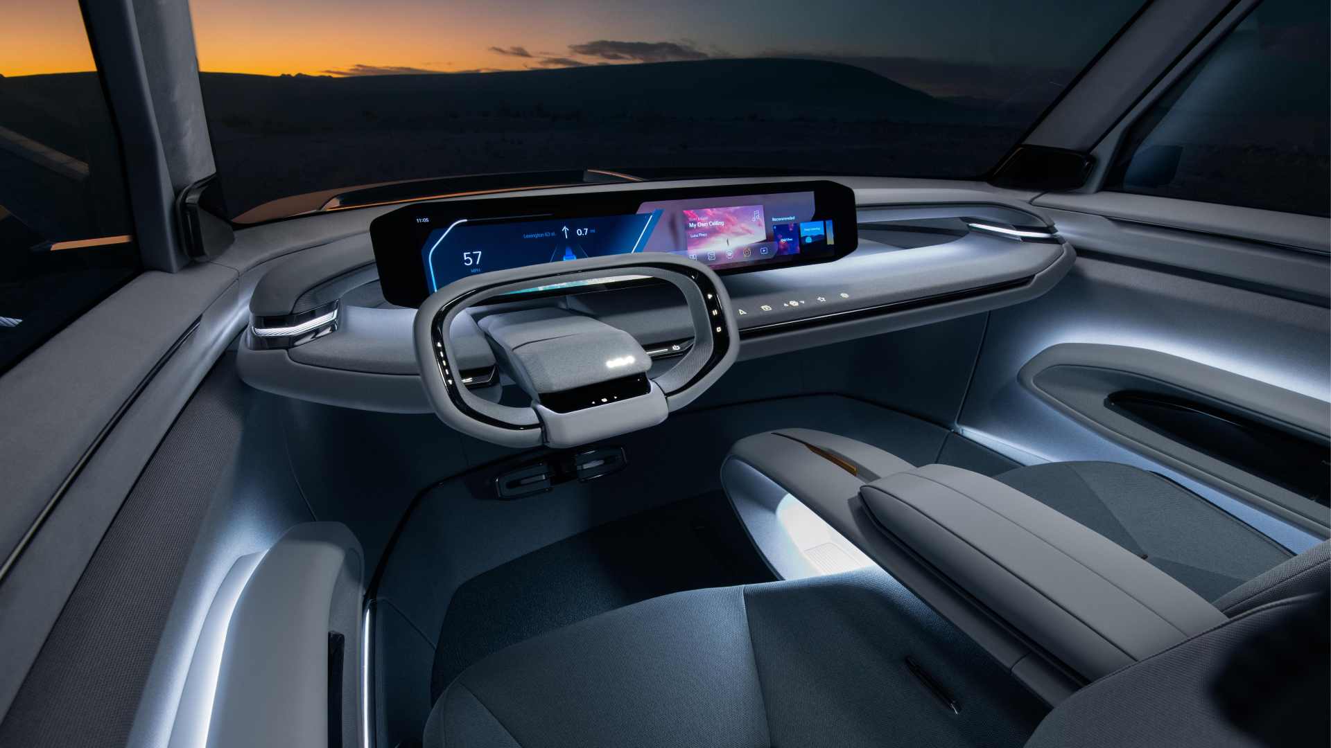 A 27-inch ultra-wide screen is the standout in an otherwise pared-back interior. Image: Kia