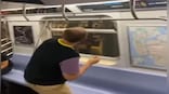 Man tries to catch cockroach in train using water bottle; watch viral video here