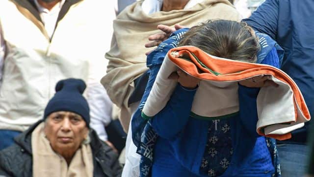 Wife of late Brigadier LS Lidder received the Tricolour as she and others pay last respects to her husband during his funeral at Brar Square, Delhi Cantt, in New Delhi. PTI