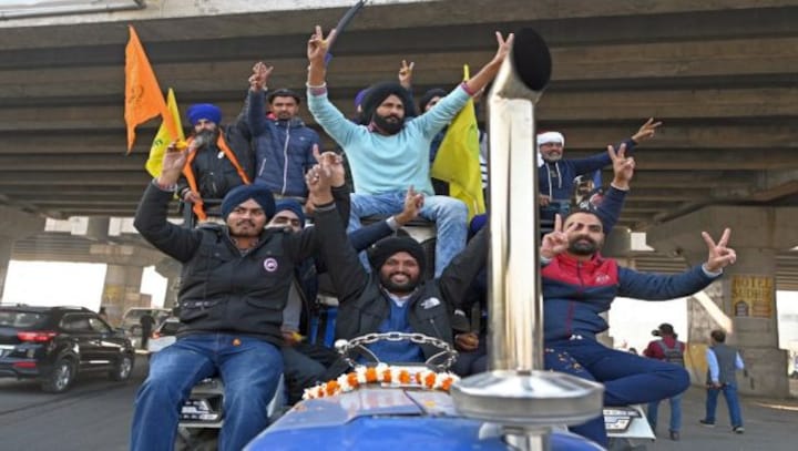 'Happiness can't be described': Celebrations as farmers vacate Delhi border after year-long protests