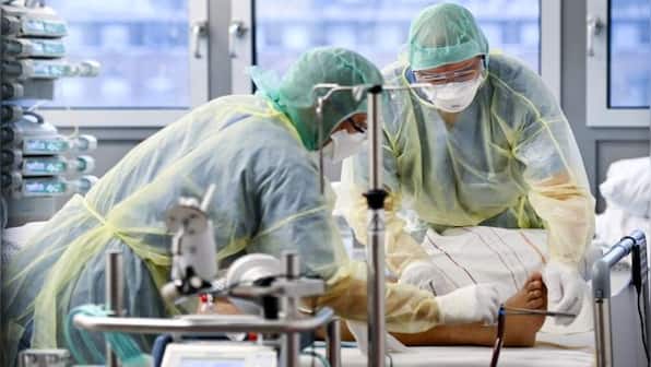 Will the pandemic end in 2022? Surging COVID-19 cases and new Omicron variant make it seem a far-off reality