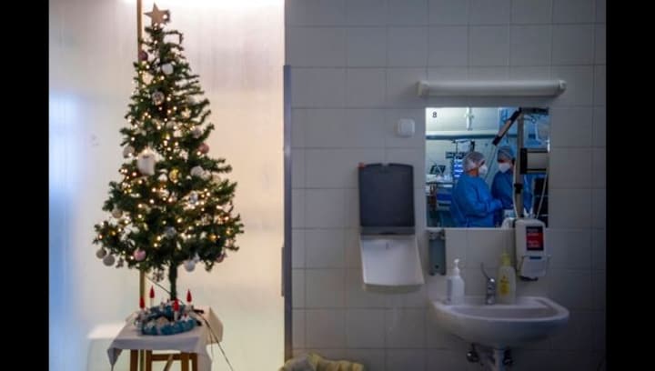 Rising COVID-19 cases driven by Omicron variant in Europe cast pall over holiday cheer