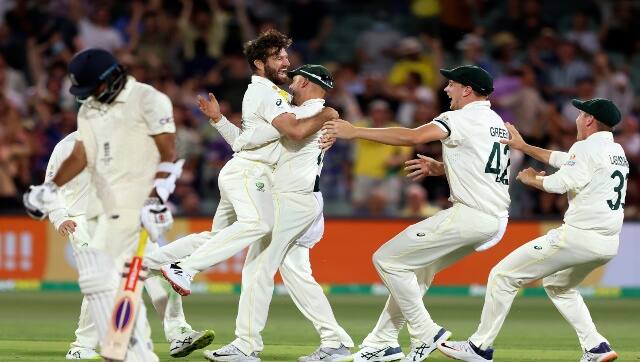 Australia's Michael Neser, second left, celebrates with teammates after taking the wicket of England's Haseeb Hameed, left, during the second day of their Ashes cricket test match in Adelaide, Australia, Friday, Dec. 17, 2021. AP