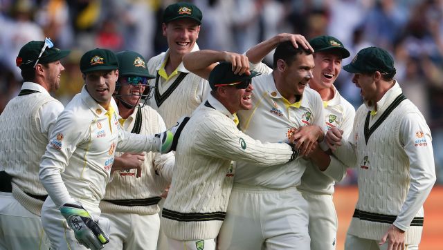 Australia's Scott Boland, third right, celebrates with teammates after taking the wicket of England's Jack Leach during the second day of their cricket test match in Melbourne, Australia, Monday, Dec. 27, 2021. (AP Photo/Asanka Brendon Ratnayake)