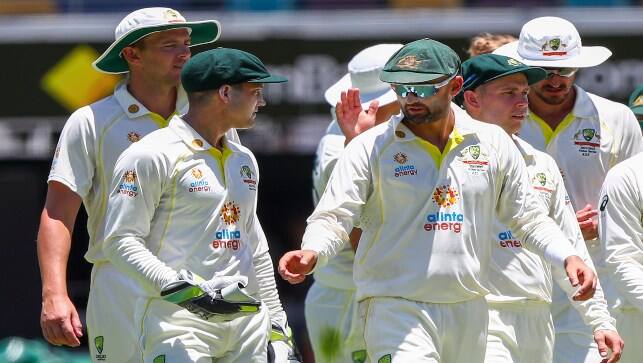Australia’s wicketkeeper Alex Carey walks with Nathan Lyon as they leave the field after dismissing England during Day 4 of the first Ashes Test at the Gabba in Brisbane, Australia, on Saturday. AP