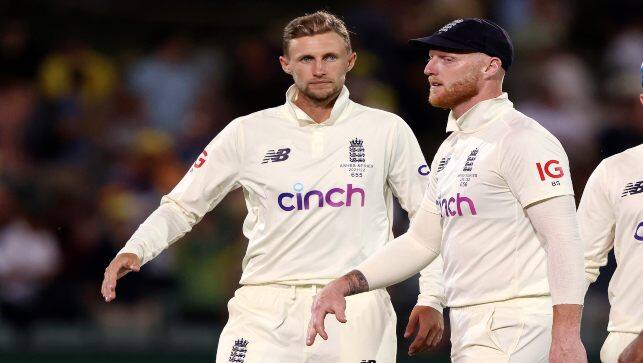 England's Joe Root, left, and Ben Stokes leave the field at stumps on the third day of their Ashes Test match against Australia in Adelaide, Australia, on Saturday. AP