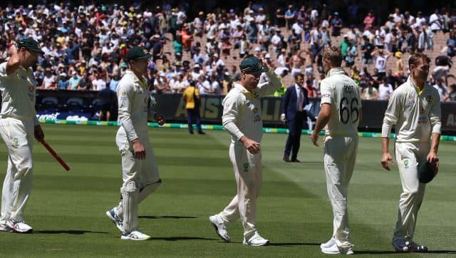 England's Joe Root, second right, shakes hands with Australian players on the third day of their cricket test match in Melbourne, Australia, Tuesday, Dec. 28, 2021. Australia wins the test by an innings and 14 runs and has retained the Ashes. (AP Photo/Asanka Brendon Ratnayake)
