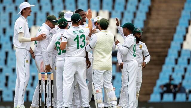 South Africa pacer Lungi Ngidi celebrates the fall of an Indian wicket with his teammates. AP