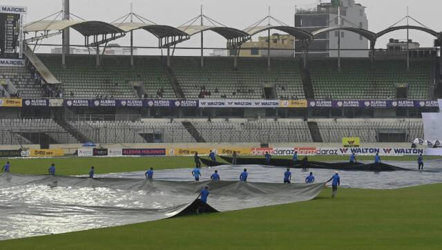 Ground staff at the Sher-e-Bangla Stadium bring out the covers on the second day of the second Test between Bangladesh and Pakistan. AFP