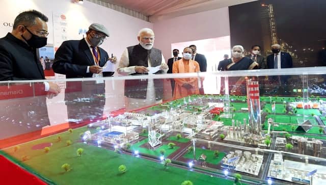Prime Minister Narendra Modi inspects a miniature model in an exhibition at the inauguration of the development projects, in Gorakhpur on Tuesday. Governor of Uttar Pradesh, Anandiben Patel, and Chief Minister Yogi Adityanath also present