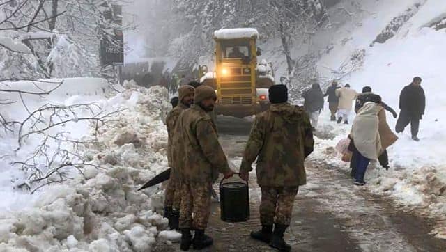 Army members take part in a rescue operation in a heavy snowfall-hit area in Murree,. AP