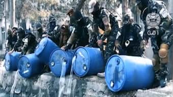Afghan agents pour 3,000 litres of liquor into Kabul canal as Taliban cracks down on alcohol