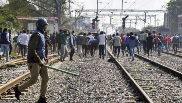 Job aspirants block railway tracks during their protest over alleged erroneous results of Railway Recruitment Boards Non-Technical Popular Categories exam 2021 in Prayagraj on Tuesday. PTI