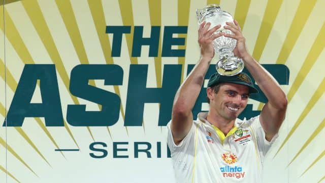 Australia's captain Pat Cummins hold the trophy after winning the Ashes match and the series against England in Hobart, Australia, on Sunday. AP
