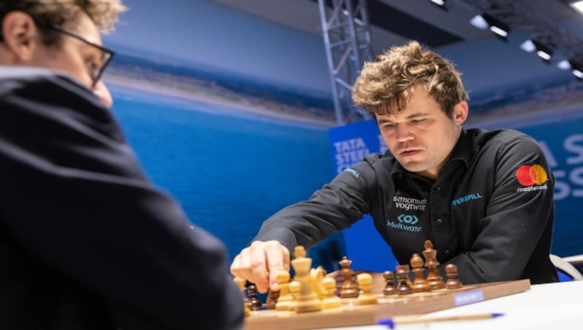 Tata Steel Chess 2022: Magnus Carlsen beats Fabiano Caruana to clinch title  with a round to spare