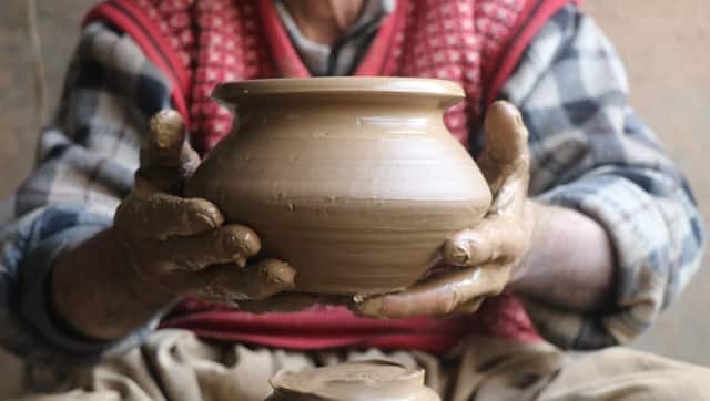 Ab Rashid Kumar showing a clay urn. This art of pottery is the only income producing practice for these potters. Image procured by author