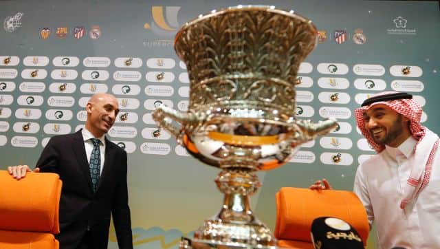 FILE - President of the Spanish Soccer Federation, Luis Rubiales, left, and Saudi General Sport Authority GSA chairman Prince Abdulaziz bin Turki Al-Faisal enter a press conference behind the Spanish Super Cup in Jiddah Saudi Arabia, Wednesday, Dec. 18, 2019. Facing criticism from human rights groups and concerned Spanish media, the president of Spain’s soccer federation defended the return of Spanish Super Cup to Saudi Arabia while Real Madrid prepares to face Athletic Bilbao in the final. Amnesty International had asked the four teams that travelled to play in the mini-tournament to wear armbands in protest of the regime’s suppression of women’s rights and attacks on persons of the LGBTQ community. (AP Photo/Amr Nabil, File)