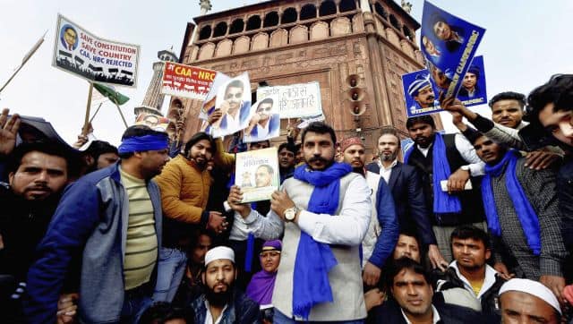 File image of Bhim Army chief Chandrasekhar Azad holds a copy of the Indian Constitution at Jama Masjid in New Delhi. PTI