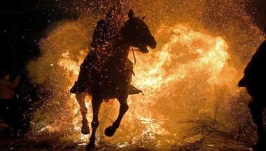Rein of fire: Horses leap through flames as part of Las Luminarias festival celebrated in Spain