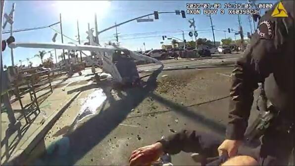Caught on camera: Pilot rescued from debris of crashed jet in LA moments before train hits