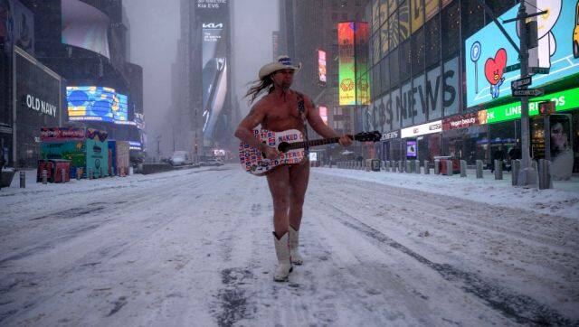 The Naked Cowboy performs during a snow storm in Times Square, New York. AFP