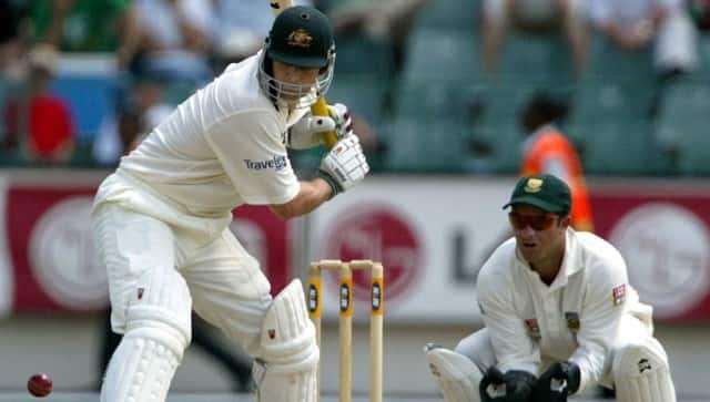Australia's batsman Adam Gilchrist (L) defends the wicket 23 February 2002 as South Africa's keeper Mark Boucher prepares for a catch, during the second day of the first Cricket test between South Africa and Australia, at the Wanderers Cricket grounds in Johannesburg. AFP PHOTO YOAV LEMMER (Photo by YOAV LEMMER / AFP)