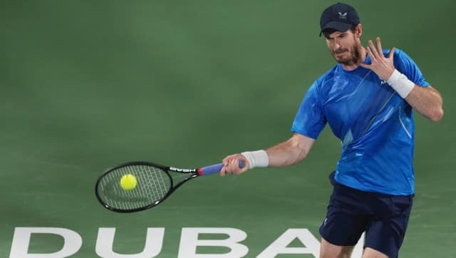 Andy Murray of Britain return the ball to Christopher O'Connell of Australia during a match of the Dubai Duty Free Tennis Championship in Dubai, United Arab Emirates, Monday, Feb. 21, 2022. (AP Photo/Ebrahim Noroozi)