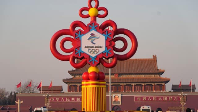 Residents look at a gigantic red ribbon 2022 Winter Olympics sculpture on Tiananmen Square in Beijing, China, on Jan. 18, 2022. China has thousands of years of doing things in a really big way, reinforcing its perceived place in the world and the political power of its leaders — from emperors to Mao Zedong to Xi Jinping. None of this bigness is new. It goes back to a dozen dynasties that ruled China for thousands of years, a tradition of projecting power that was adopted by the Chinese Communist Party when it came to power in 1949. It could be termed simply: big, bigger and biggest — and then some. (AP Photo/Ng Han Guan)
