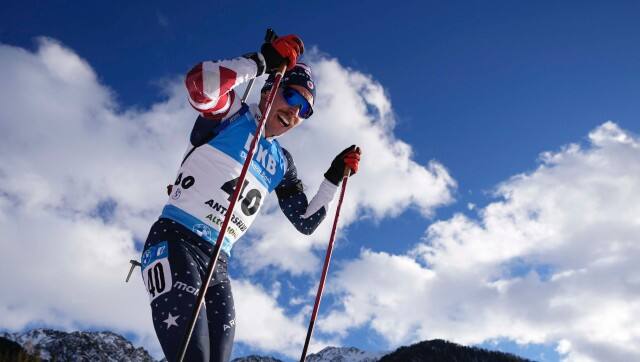 **HOLD AND MOVE WITH STORY**FILE- Jake Brown of the United States competes during the men's 20km individual race at the biathlon World Cup in Anterselva, Italy, Thursday, Jan. 20, 2022. Biathlon is the marriage of “two totally unrelated things,” said U.S. biathlete Jake Brown of Saint Paul, Minnesota. “One is totally physical, and the other is part physical but mostly mental. Having to combine that mental exertion on the range when you’re under physical duress from skiing is really the difficulty of our sport.”(AP Photo/Matthias Schrader, File)