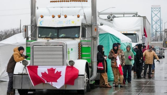 Canada lawmakers extend emergency powers to police for truckers' protests Canada lawmakers extend emergency powers to police for truckers' protests