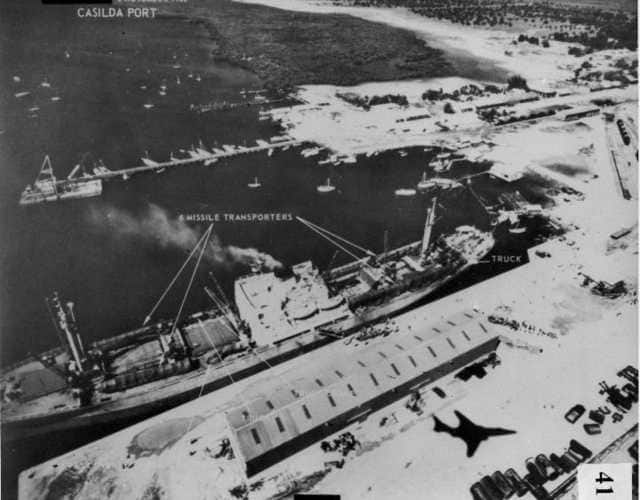 Port Casilda, Cuba, is captured by an RF-101 pilot with the 363rd Tactical Reconnaissance Wing on 6 November 1962, while the aircraft itself casts a shadow over the port. Image courtesy Wikimedia Commons