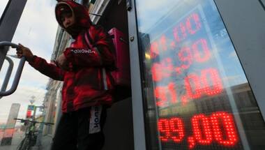 Russian central bank moves to stem plunge in ruble by raising benchmark rate