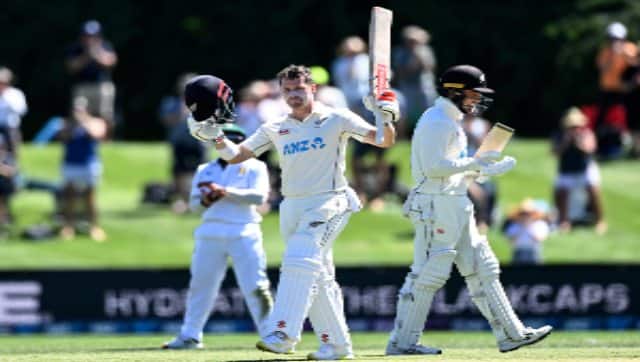 Henry Nicholls of New Zealand raises his bat to celebrate his century during Day 2 of the first Test between South Africa and New Zealand at Hagely Oval in Christchurch, New Zealand, on Friday. AP 