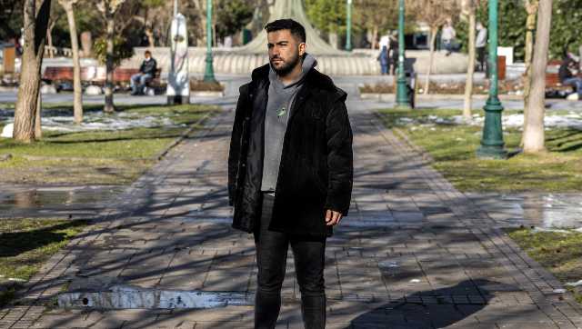 Dr Dogan Can Celik at a park in Istanbul, 28 January, 2022. He is planning to leave for Britain as soon as he completes his residency in about six months. Ivor Prickett/The New York Times