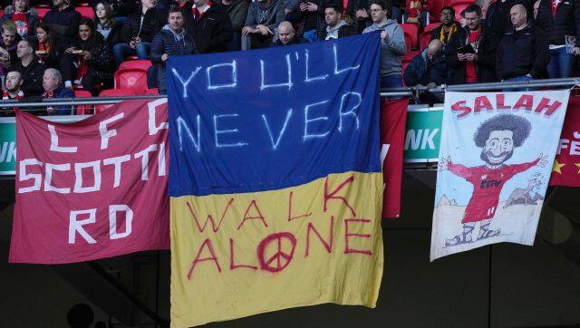 Liverpool fans display a banner in the Ukrainian colors with the message 