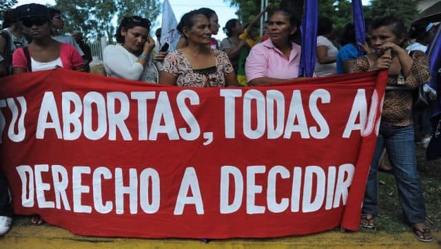 File image of Nicaraguan activists holding a banner reading 