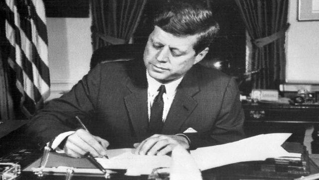 File image of US president John F Kennedy signing the order of naval blockade of Cuba, in the White House, Washington DC, during the Cuban missiles crisis. AFP