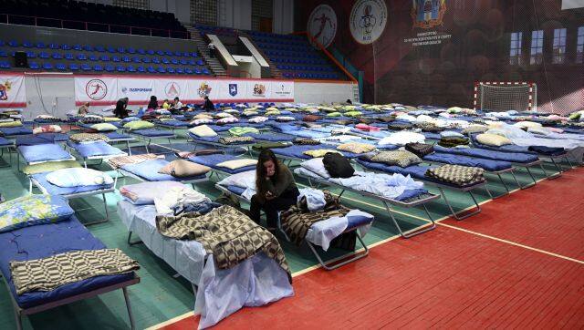 Displaced civilians from the Donetsk and Luhansk regions, the territory controlled by pro-Russia separatist governments in eastern Ukraine, rest in a sport hall in Taganrog, Russia. AP