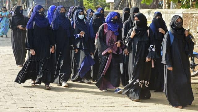 Students of government Pre-University college in Kundapur town wearing hijab arrive at their college in Udupi district in Karnataka. AFP