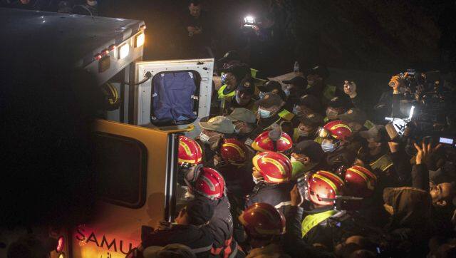 Rescue workers carry the body of 5-year-old Rayan and place it in an ambulance after it was retrieved from a hole in which he was stuck for several days, in the village of Ighran in Morocco's Chefchaouen province. AP