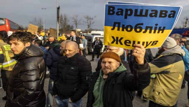Volunteers offer transportation and accomodation in and to Polish cities as Ukrainian refugees arrive with buses from the Medyka pedestrian border crossing, in Przemsyl, eastern Poland. AFP