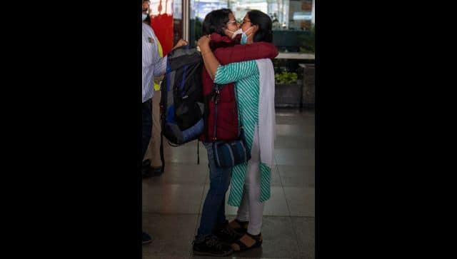 An Indian student studying in Ukraine who fled the conflict hugs her mother after she arrived at Indira Gandhi International Airport