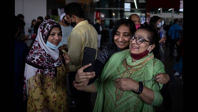 An Indian student studying in Ukraine who fled the conflict takes a selfie with her mother upon her arrival at Indira Gandhi International Airport . AP