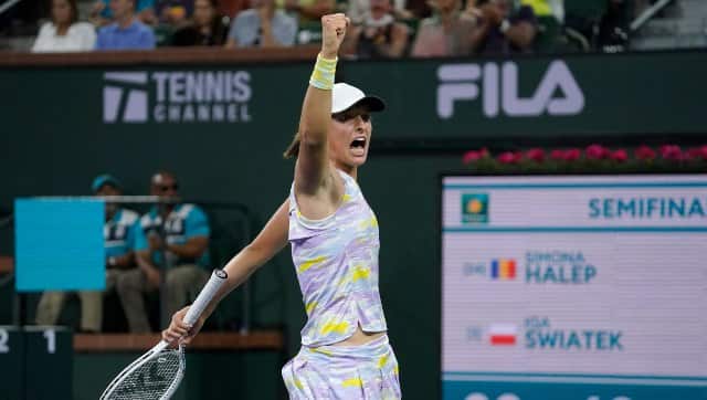 Iga Swiatek, of Poland, react to winning a game during her women's singles semifinals match against Simona Halep. AP