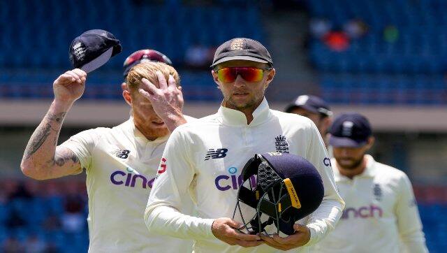 England's captain Joe Root leads his team off the field after losing against West Indies by 10 wickets on Day 4 of their third Test at the National Cricket Stadium in St. George, Grenada, on 27 March, 2022. AP