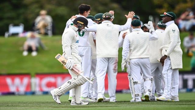 New Zealand’s Tom Blundell heads back to the dressing room as South Africa players celebrate during Day 5 of the second Test between South Africa and New Zealand at Hagley Oval in Christchurch, New Zealand, on Tuesday. AP