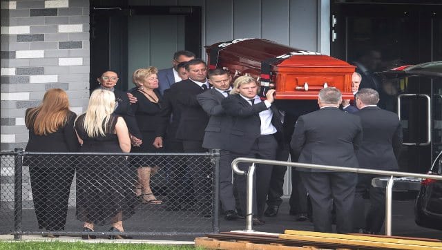  The coffin of Shane Warne is carried out by his son Jackson following a funeral service in Melbourne, Australia, on Sunday. Warne’s family and friends attended a private funeral in his hometown of Melbourne to pay their final respects to the cricketing legend. AP