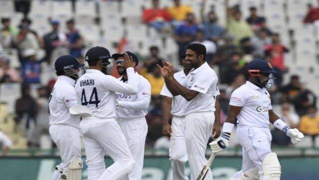 Sri Lanka’s Charith Asalanka (right) walks back to the pavilion as India’s Ravichandran Ashwin (second right) celebrates with teammates after his dismissal during Day 3 of the first Test between India and Sri Lanka in Mohali on Sunday. AFP