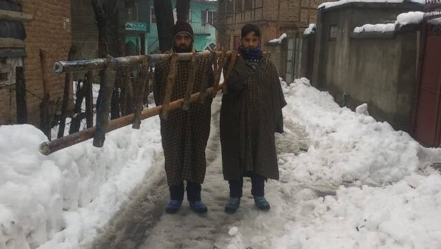Mohammad Rafi carrying a ladder to work. Image by Farzana Nisar
