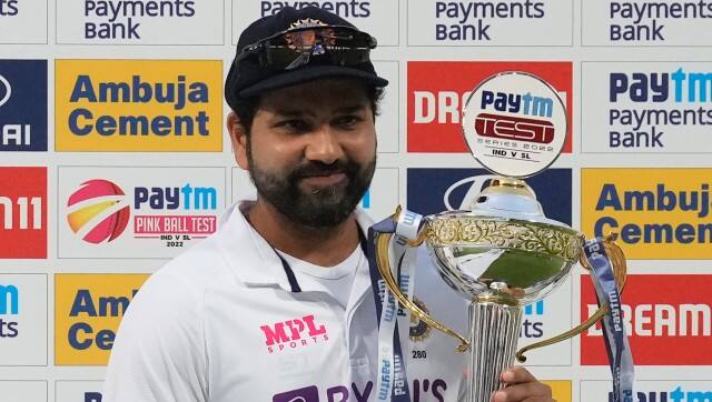 India's captain Rohit Sharma poses with the winners trophy after their win in the second cricket test match against Sri Lanka in Bengaluru, India, Monday, March 14, 2022. India won the series 2-0. (AP Photo/Aijaz Rahi)